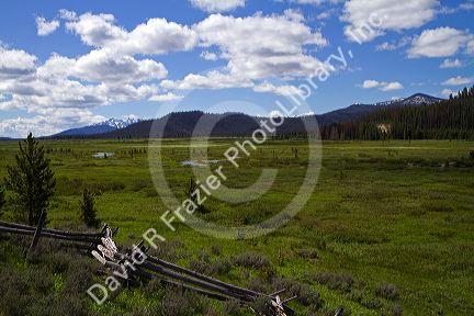 Split rail fencing runs through a meadow near Stanley, Idaho, USA.