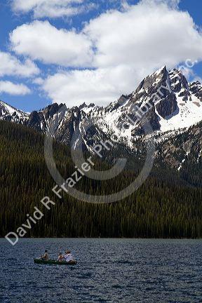 Canoeing on Stanley Lake in the Sawtooth Mountain Range near Stanley, Idaho, USA.