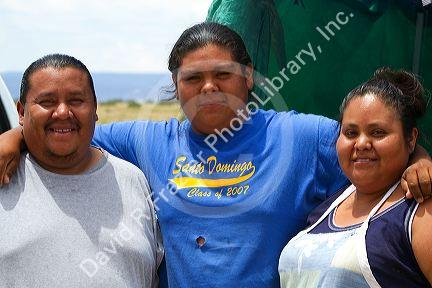 Native Pueblo family members at Santo Domingo Pueblo, New Mexico, USA. MR