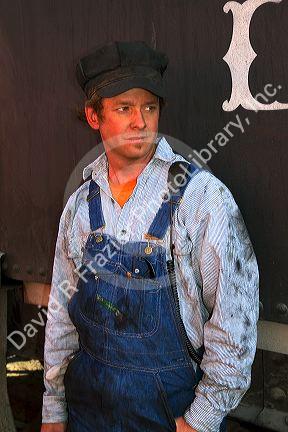 Steam locomotive fireman on the Durango and Silverton Narrow Gauge Railroad located in Durango, Colorado, USA.