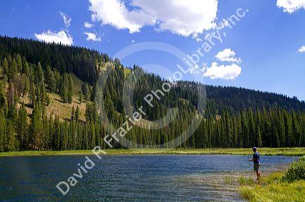 Fishing Bull Trout Lake located in the Boise National Forest near Lowman, Idaho, USA.