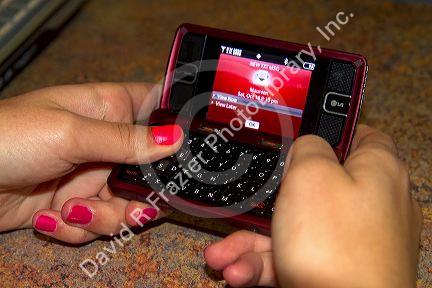 Text messaging on a cell phone.