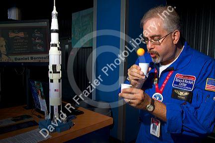 Museum volunteer demonstrates the Bernoulli principle at the U.S. Space and Rocket Center located in Huntsville, Alabama, USA.