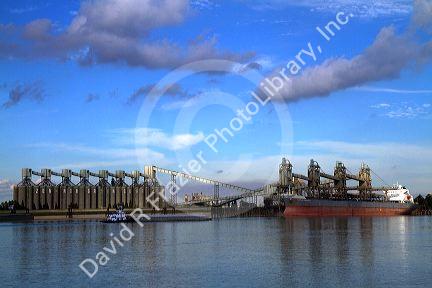 Bulk freighter at a grain shipping terminal on the Mississippi River at the Port of Baton Rouge, Louisiana, USA.