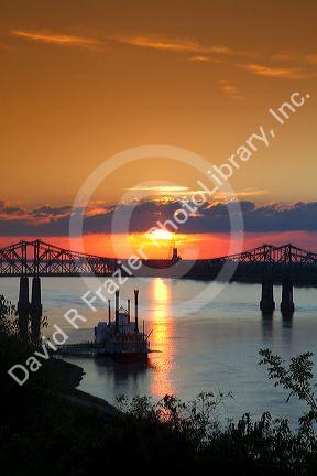 Sunset with steamboat under the Natchez-Vidalia Bridges spanning the Mississippi River between Vidalia, Louisiana and Natchez, Mississippi, USA.
