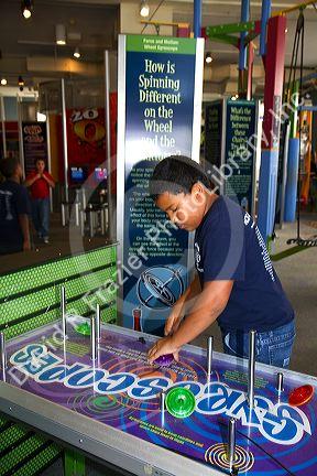 Boy using an interactive exhibit at the Gulf Coast Exploreum Science Center in Mobile, Alabama, USA.
