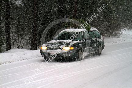 Winter driving in snow and ice at Mores Creek in Boise County, Idaho, USA.