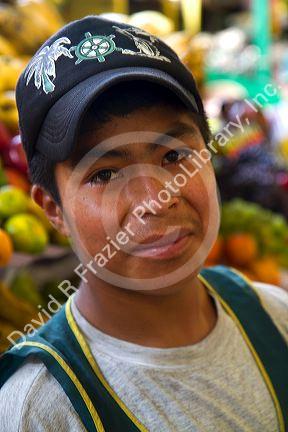 Vendor at a cooperative produce market in the Chorrillos district of Lima, Peru.