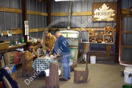 Maple syrup displays at a sugar shack in Lake Odessa, Michigan, USA.