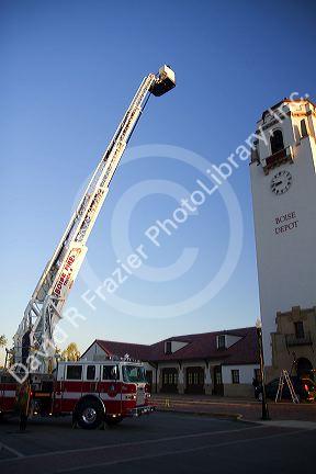 Firetruck testing 100 foot aerial ladder at the Boise Union Pacific Depot in Boise, Idaho, USA.