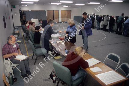 People in the voting booths and precinct workers at a polling station in Boise, Idaho.