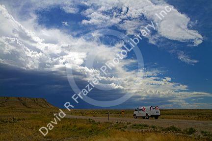 Storm clouds and highway near Green River, Wyoming, USA.