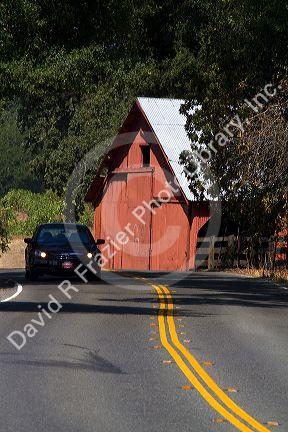 Red barn along Highway 128 near Geyserville, California, USA.