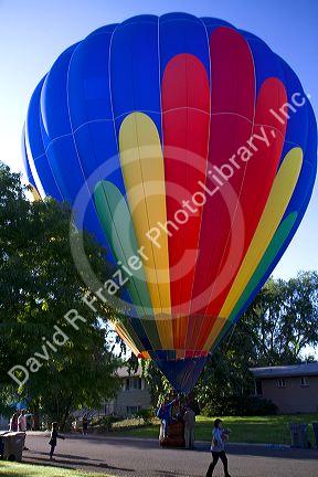 Hot air balloon landing in a residential area of Boise, Idaho, USA.