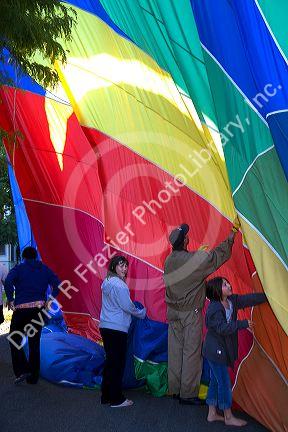 Hot air balloon landing in a residential area of Boise, Idaho, USA.