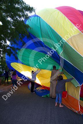Hot air balloon landing in a residential area of Boise, Idaho, USA.