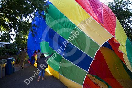 Hot air balloon landing in a residential area of Boise, Idaho, USA.