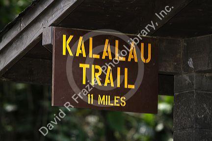 Kalalau trailhead sign marking a trail along the Na Pali Coast on the island of Kauai, Hawaii, USA.