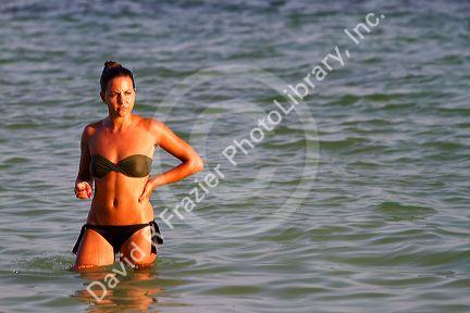 Woman wearing a bikini at Chaweng beach in the Gulf of Thailand on the island of Ko Samui, Thailand.