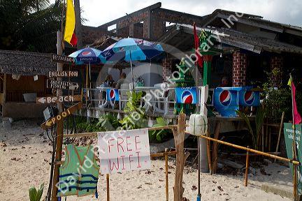 Sign reading free wifi at a restaurant on the island of Ko Samui, Thailand.