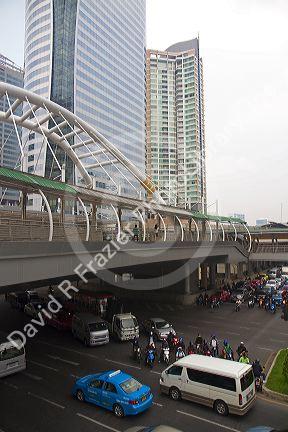 BTS Skytrain station and modern office buildings in Bangkok, Thailand.