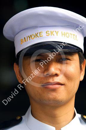 Doorman of the Baiyoke Sky Hotel located in the Baiyoke Tower II in the Ratchathewi district of Bangkok, Thailand.