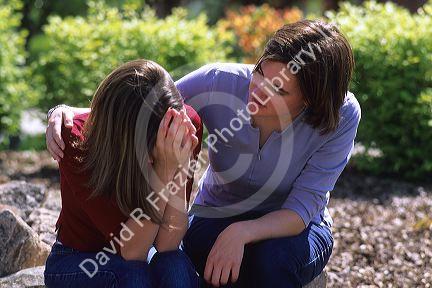 A teen comforting a depressed friend.  MR