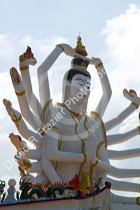 18 arm Buddha statue at Wat Plai Laem temple located on the island of Ko Samui, Thailand.