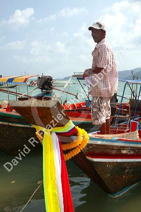 Fisherman on his boat in the Gulf of Thailand on the island of Ko Samui, Thailand.