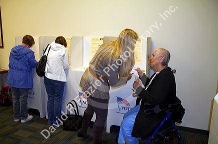 People vote in cardboard voting booths at a polling station in Boise, Idaho, USA.