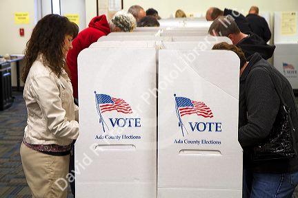 People vote in cardboard voting booths at a polling station in Boise, Idaho, USA.