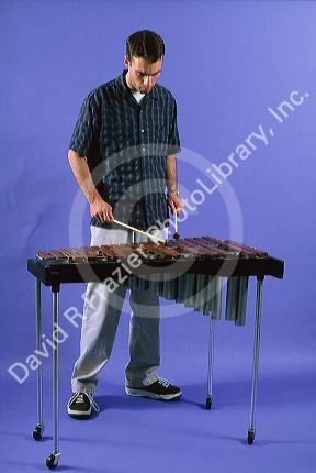 A man playing a xylophone.