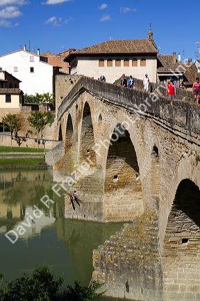 Six-arched Roman bridge spanning the Arga River on the Way of St. James pilgrimage route in Puente La Reina, Navarra, Spain.