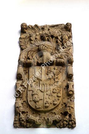 Coat of arms carved in a stone wall at Santillana del Mar, Cantabria, Spain.