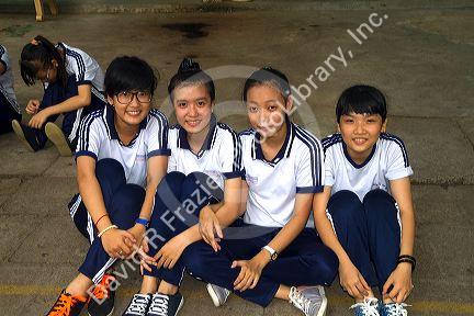 Vietnamese elementary school students wearing uniforms in Nha Trang, Vietnam.