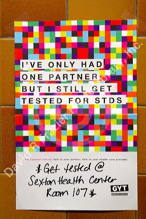 Flyer for the Get Yourself Tested Campaign for STD awareness resources posted at J.W. Sexton High School in Lansing, Michigan, USA.