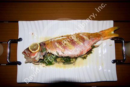 Whole cooked fish at a restaurant in Kona, Hawaii, USA.