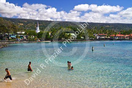 People swimming in the bay at Kailua-Kona on the Big Island of Hawaii, Hawaii, USA.