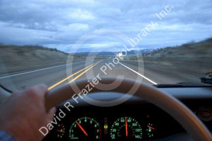 Lonely highway at dusk.  US 95 near McDermitt, Nevada from the driver's perspective.