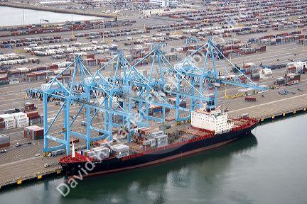 Containers being unloaded from a ship at the Port of Long Beach in Los Angeles, California.