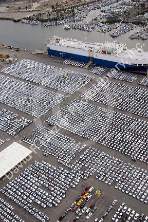 Automobiles being unloaded from a ship at the Port of Long Beach in Los Angeles, California.