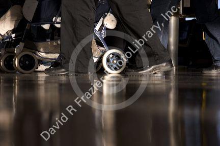 Feet walking at an airport.
