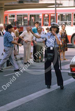 A policewoman directing traffic in Madrid, Spain.