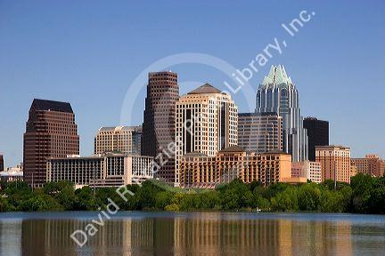 Cityscape skyline view of Austin, Texas with City Lake in the foreground.