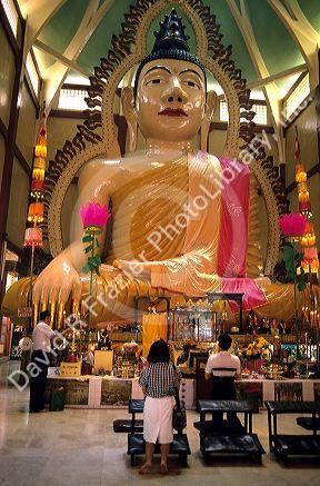 A budda statue at the Temple of 1000 Lights in Singapore.