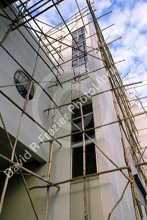 Bamboo scaffolding on building under construction in Singapore.