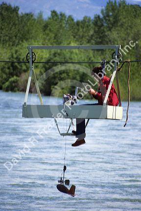 Hydrologist tests water quality and stream flow in the Boise River, Idaho.