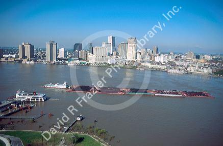 Tug boat and barge tow of coal on the Mississippi River at New Orleans, Louisiana.