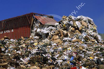 A large dumpster unloads trash at a sanitary landfill in Boise, Idaho.