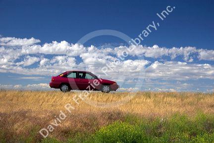 Automobile traveling on the highway.